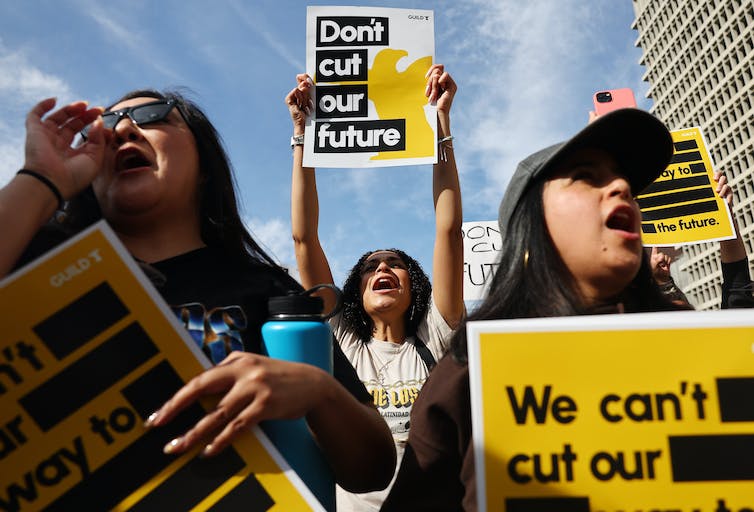 Los Angeles Times employees stage a walkout on Jan. 19, 2024, after learning about layoffs